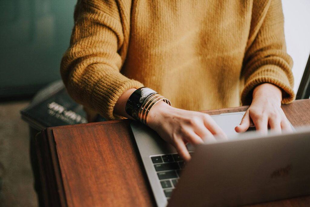 Woman typing on a computer