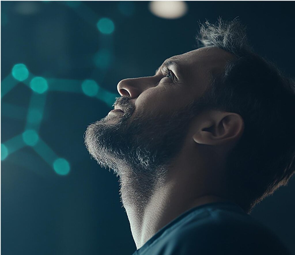 Man looking upward with molecular structure in background